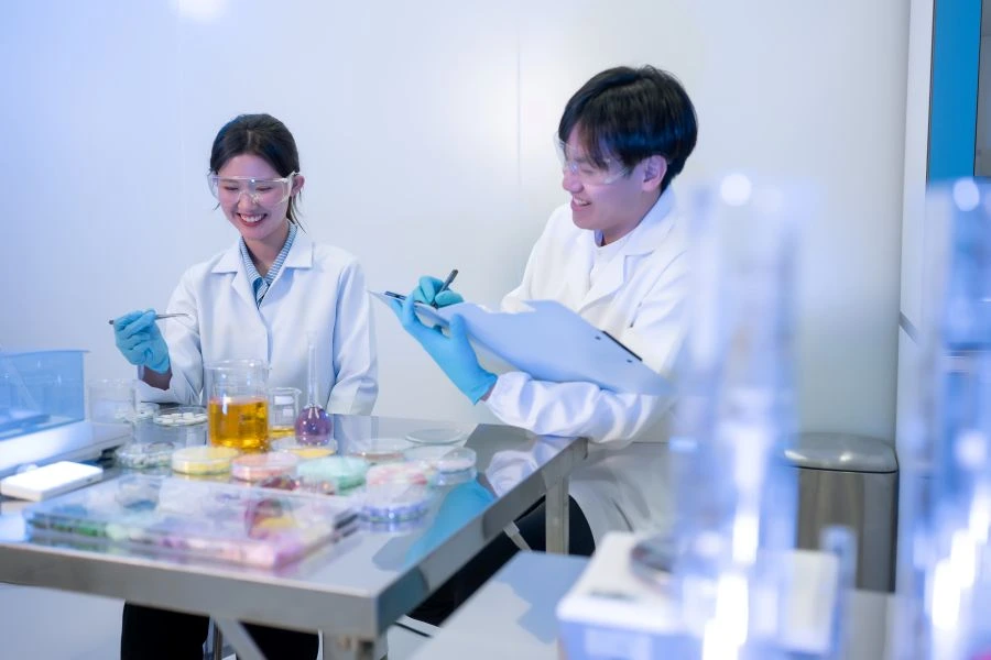 Researchers in a lab with supplements